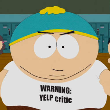 Eric Cartman from the cartoon show South Park wearing a t-shirt that reads Warning Yelp Critic.
