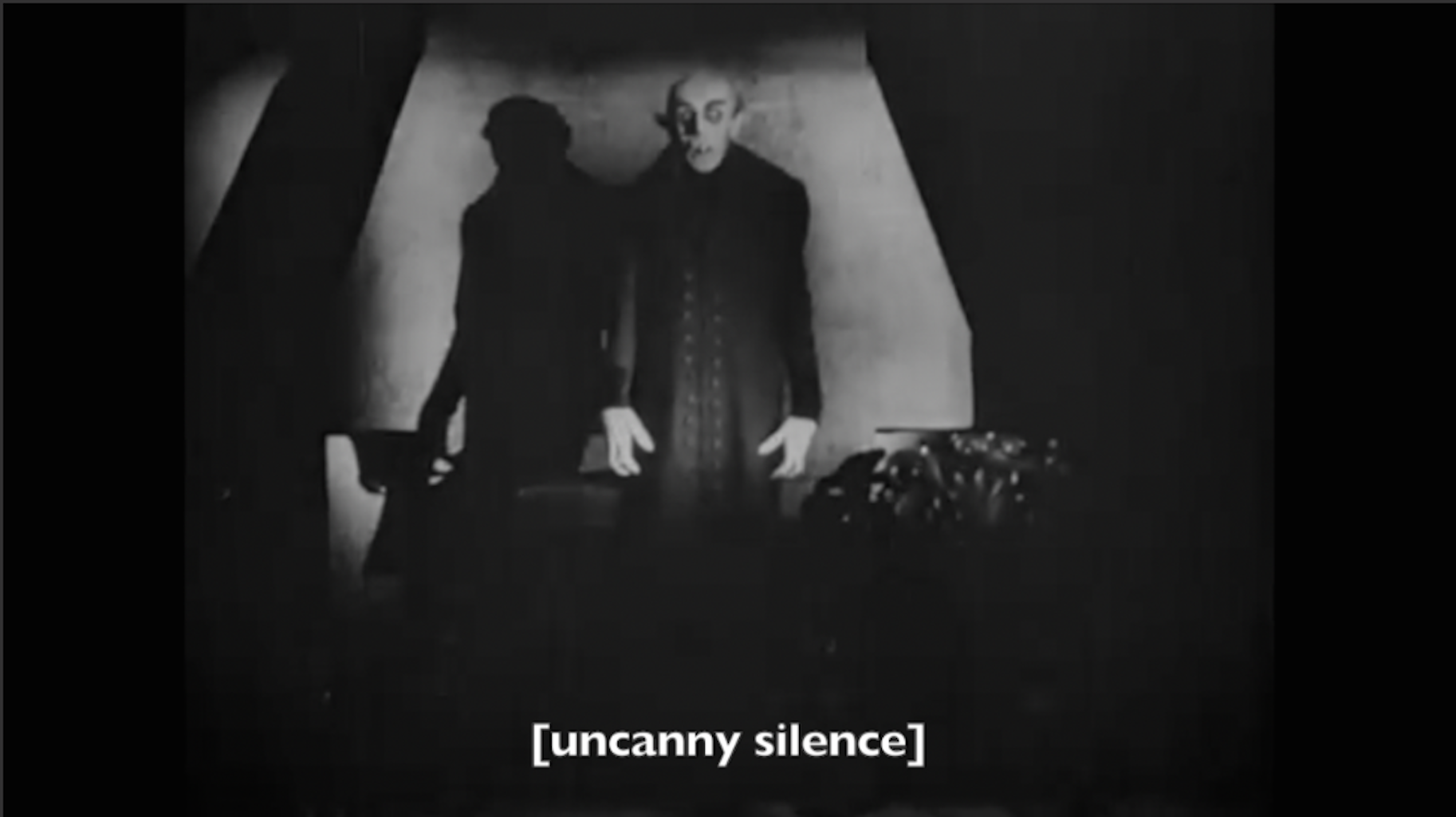Image of Nosferatu with a caption that reads "uncanny silence" in brackets.