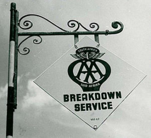 A black and white image of a sign that reads " AA South Africa Breakdown Service"