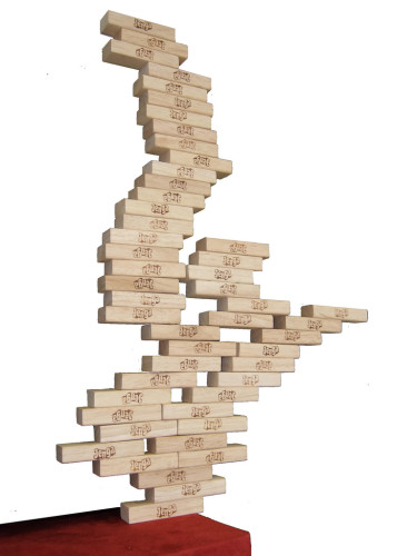 A precariously balanced tower of Jenga blocks. The upper blocks branch out horizontally from a narrow base of one block.