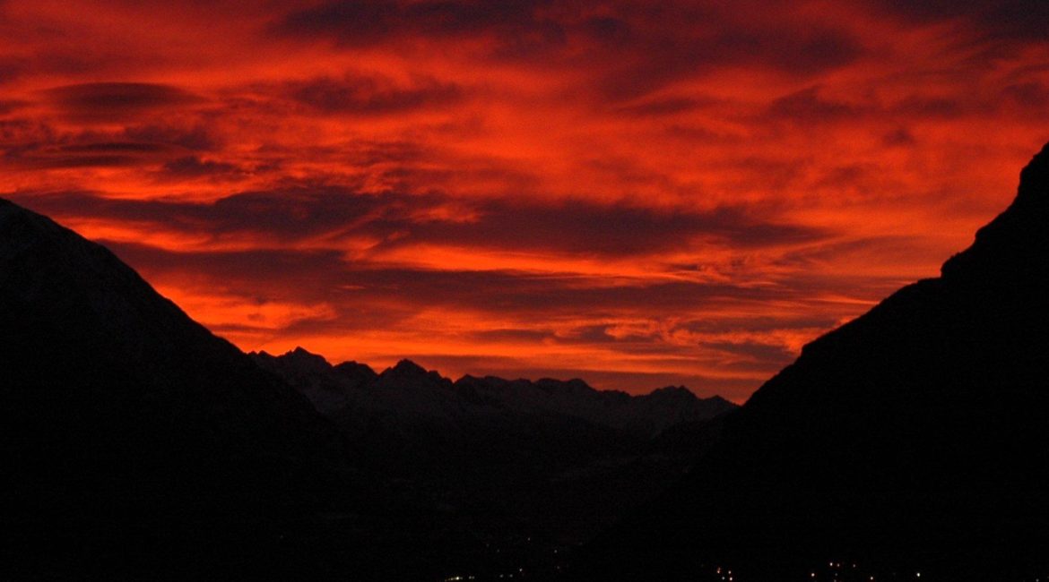 A red sky over a valley.