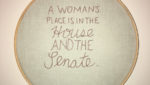 hoop cross stitch reads: "a woman's place is in the house and senate"