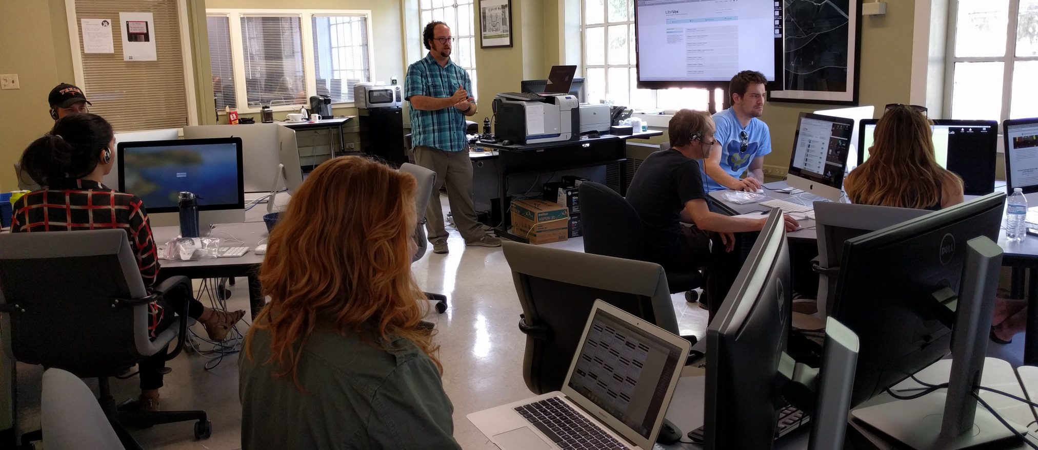 This is a photo of the DWRL coordinator, Will Burdette, speaking to some of the lab's staff, during a audio recording workshop in Parlin Hall, room 102.