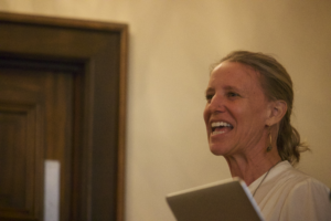 Dr. Laurie Gries speaking at a lectern