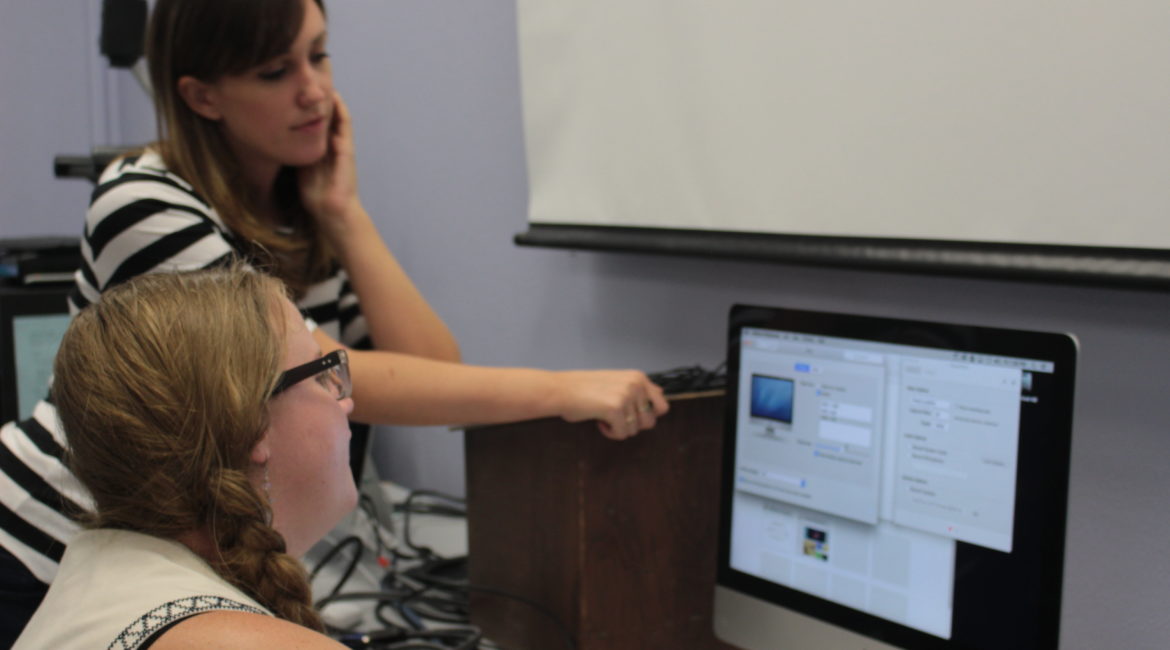 Sarah Welsh and Rae Piwarski working on a screen cast.