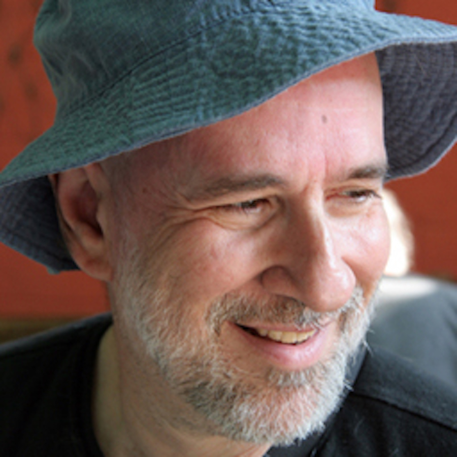 Photo of John Slatin in a blue hat